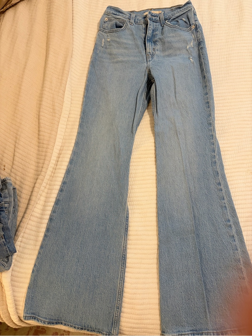 Levi's Light Blue Flare Jeans with Subtle Distress